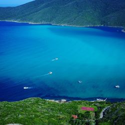 High angle view of sea against blue sky