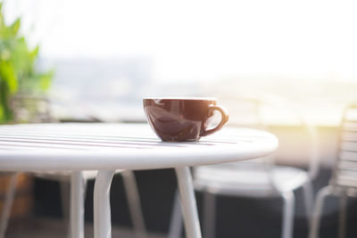 Close-up of coffee cup on table