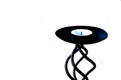 Close-up of electric lamp against white background