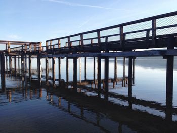 Pier over sea against sky