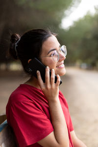 Portrait of woman using mobile phone