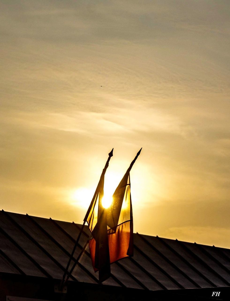 LOW ANGLE VIEW OF ROOF AGAINST SKY