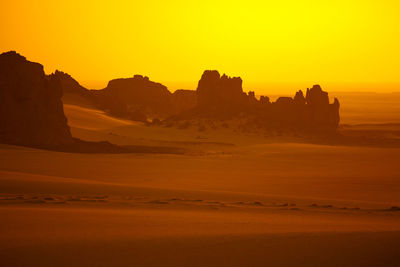 Scenic view of silhouette landscape against sky during sunset