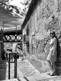 Full length of woman standing on walkway