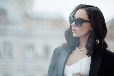 Portrait of a young woman wearing sunglasses