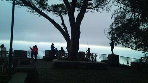 Silhouette of woman against sky