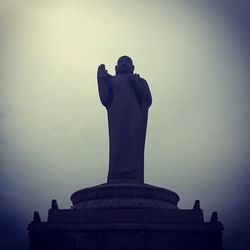 Low angle view of statue against sky