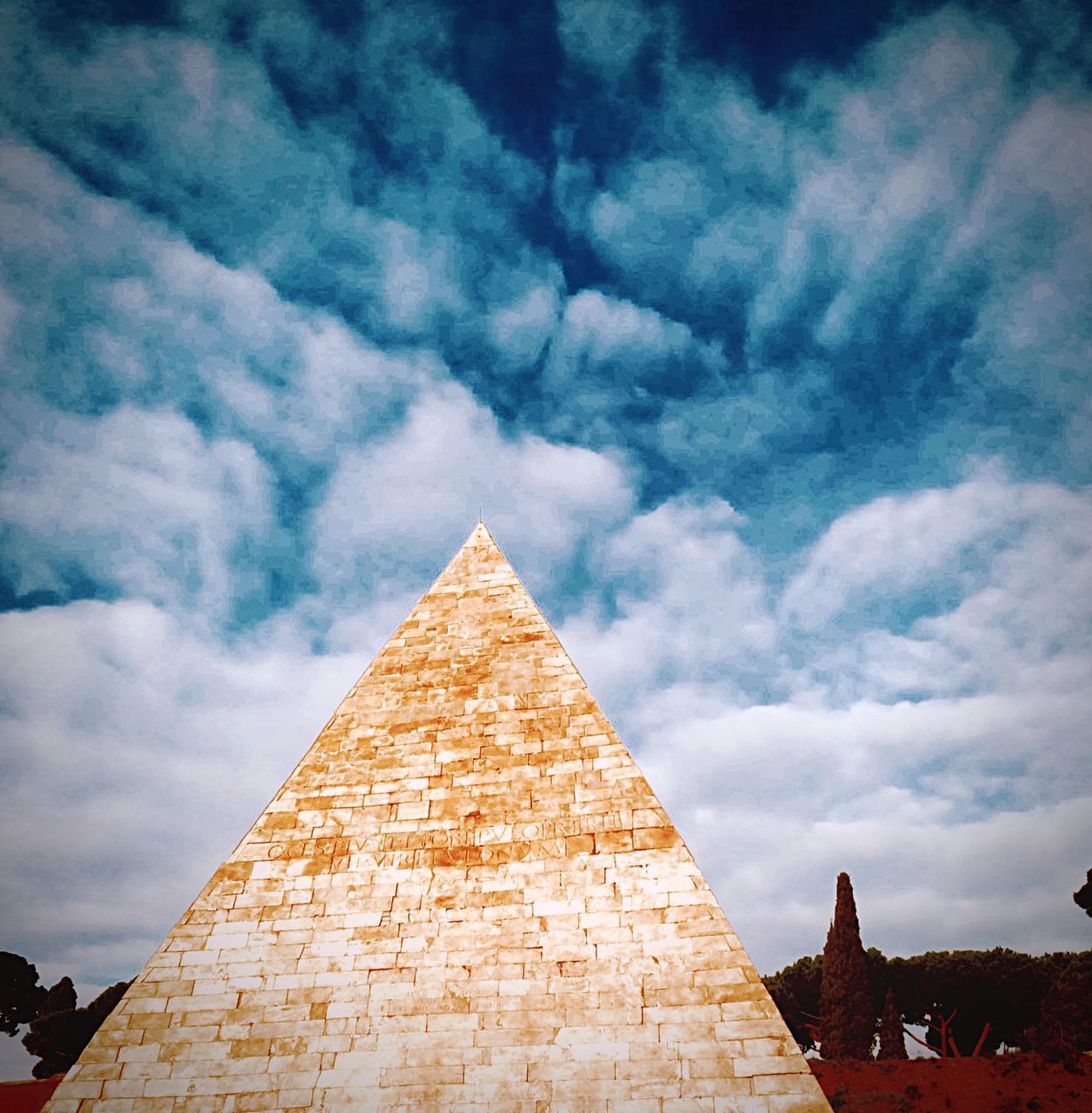 architecture, built structure, building exterior, sky, cloud - sky, low angle view, religion, place of worship, cloudy, spirituality, cloud, church, high section, outdoors, history, temple - building, cross, no people