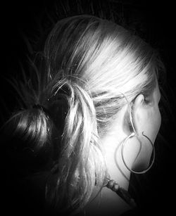 Close-up of girl looking away over white background