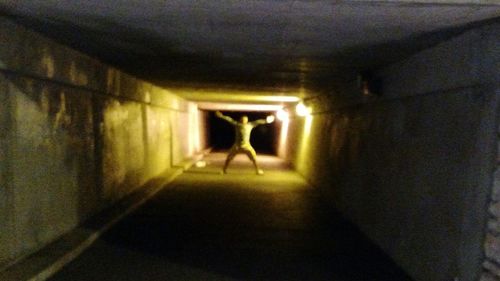 Close-up of illuminated lamp against wall