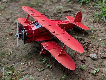 Close-up of red toy car on field