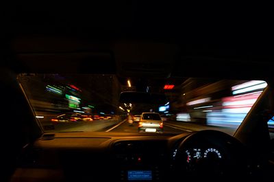 Cars moving on road at night