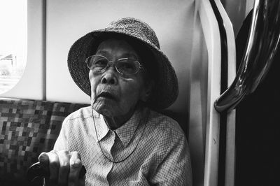 Portrait of man wearing hat at home