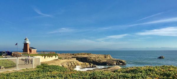 Scenic view of sea and buildings against sky