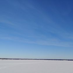 Sky and ice. west hawk lake created by a meteor a long time ago. the lake is 400 ft/122m  deep.  