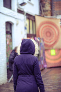 Rear view of people walking outdoors