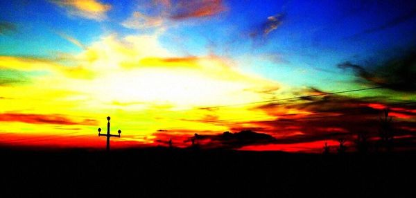 Scenic view of landscape against dramatic sky