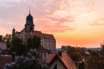 Buildings against sky during sunset