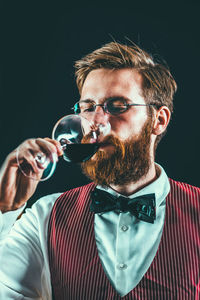 Close-up sommelier drinking wine