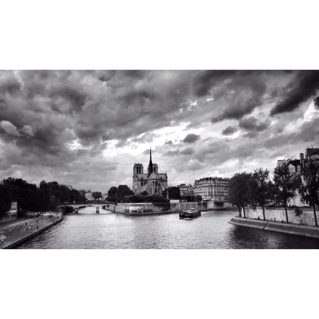 architecture, sky, building exterior, built structure, water, cloud - sky, river, transfer print, cloudy, cloud, city, waterfront, auto post production filter, tree, day, canal, overcast, outdoors, rippled, transportation