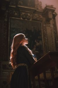 A woman praying in church