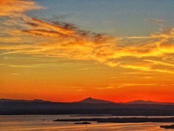 Scenic view of silhouette landscape against romantic sky at sunset