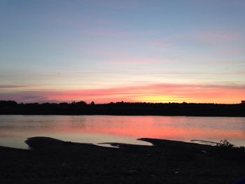 Scenic view of lake at sunset