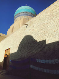 Low angle view of building against blue sky