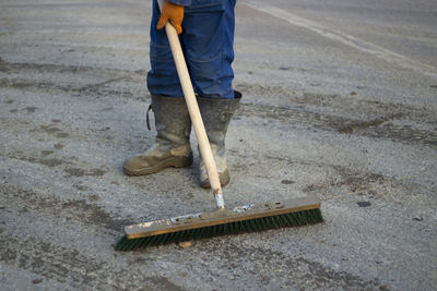 Low section of man working on road