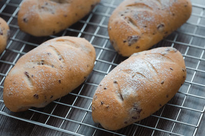 High angle view of bread on metal grate