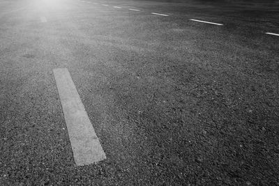 High angle view of arrow symbol on road