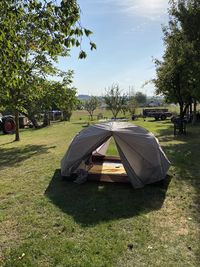 Tent in park against sky