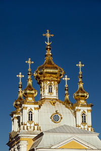 Low angle view of building against blue sky