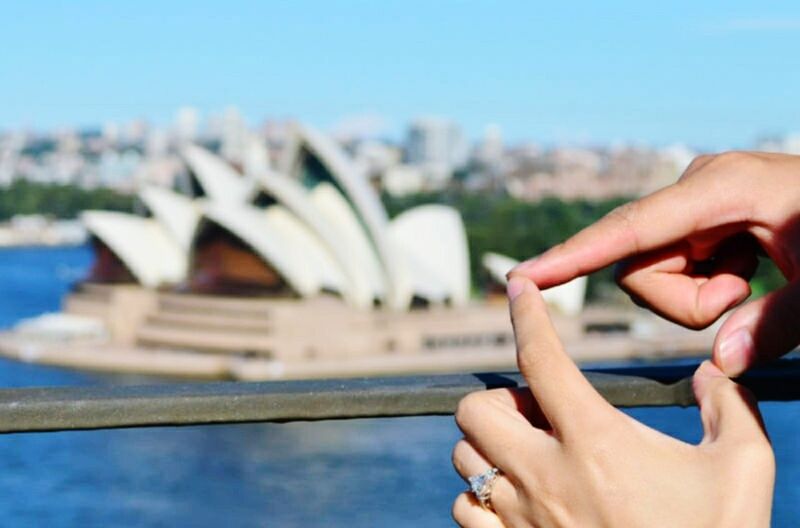 person, cropped, part of, focus on foreground, holding, clear sky, human finger, close-up, personal perspective, unrecognizable person, built structure, connection, leisure activity, architecture, selective focus, lifestyles, day