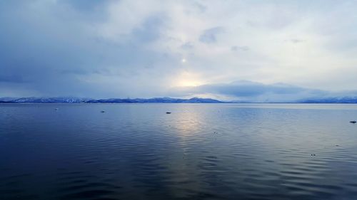 Scenic view of sea against cloudy sky