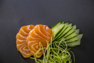 Close-up of fish on table against black background