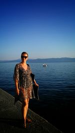 Woman standing on beach