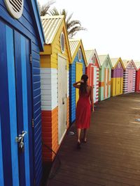 Full length of woman standing in front of building