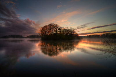 Scenic view of lake against sky during sunset