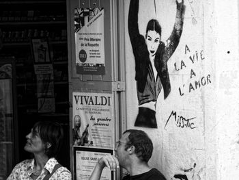 High angle view of people and text on wall