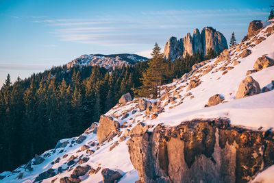 Scenic view of snow covered mountains against sky