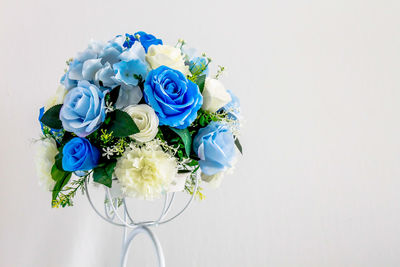 Close-up of rose bouquet against white background