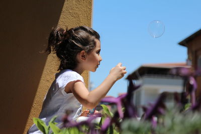 Girl looking at bubbles