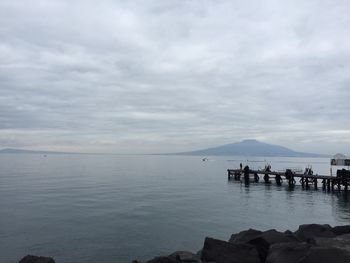 Scenic view of sea against cloudy sky