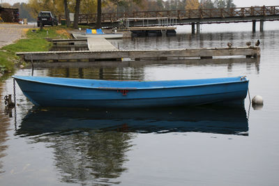 Boat moored in lake