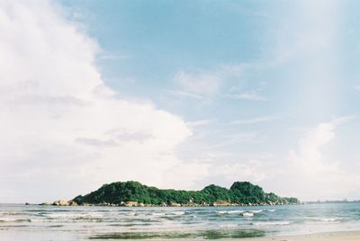 Scenic view of beach and sea against sky