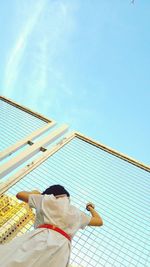 Low angle view of man swimming in pool