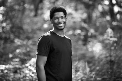 Portrait of young man standing outdoors