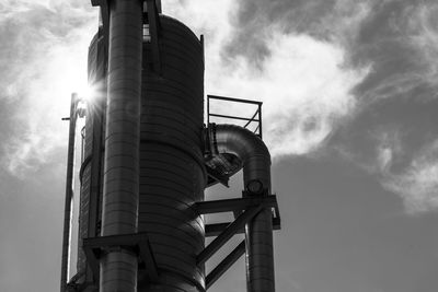 Low angle view of industrial building against sky