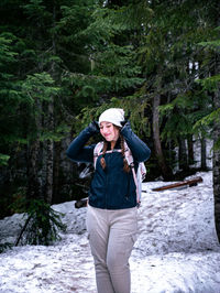 Rear view of man standing in forest